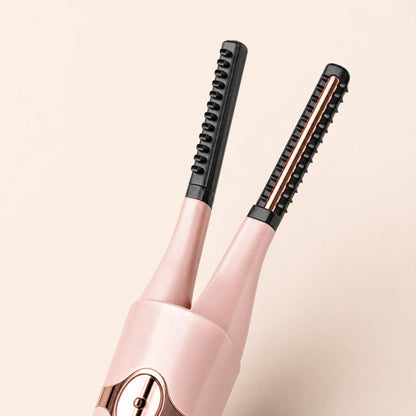 Close-up of the Lumivea dual-comb head and rose-gold heating bar