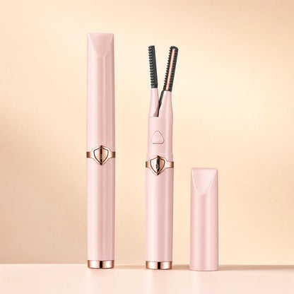 Pink Lumivea heated lash curler shown capped and open